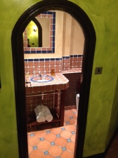 Our prettily tiled bathroom packed full of soft towels and L'Occitane goodies...